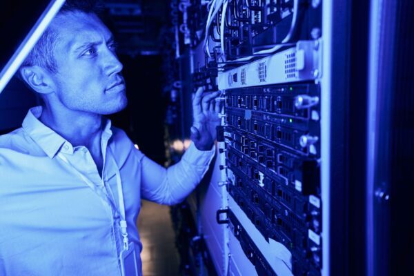 focused data center employee monitoring equipment 2024 10 20 08 49 19 utc scaled e1747736197873